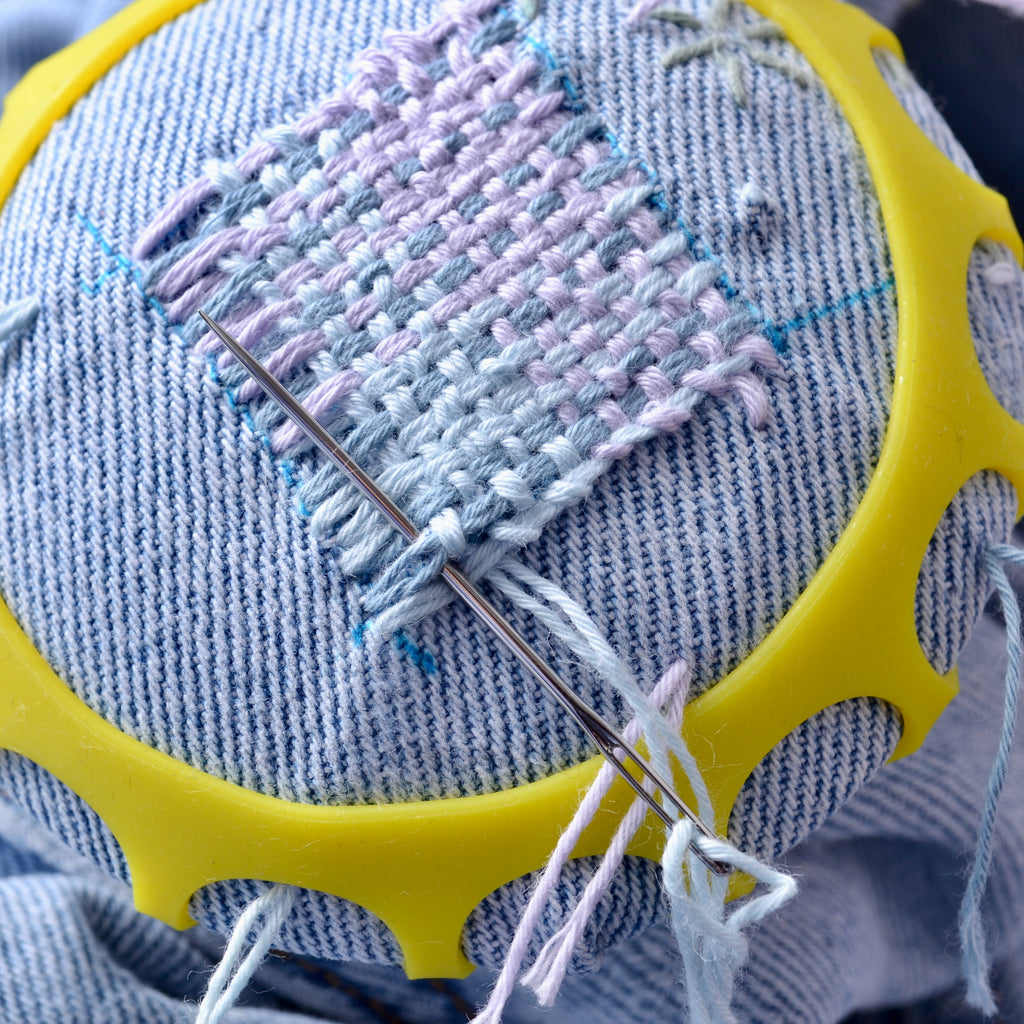 Making a woven mend on blue jeans using the Stitch Dome Tool