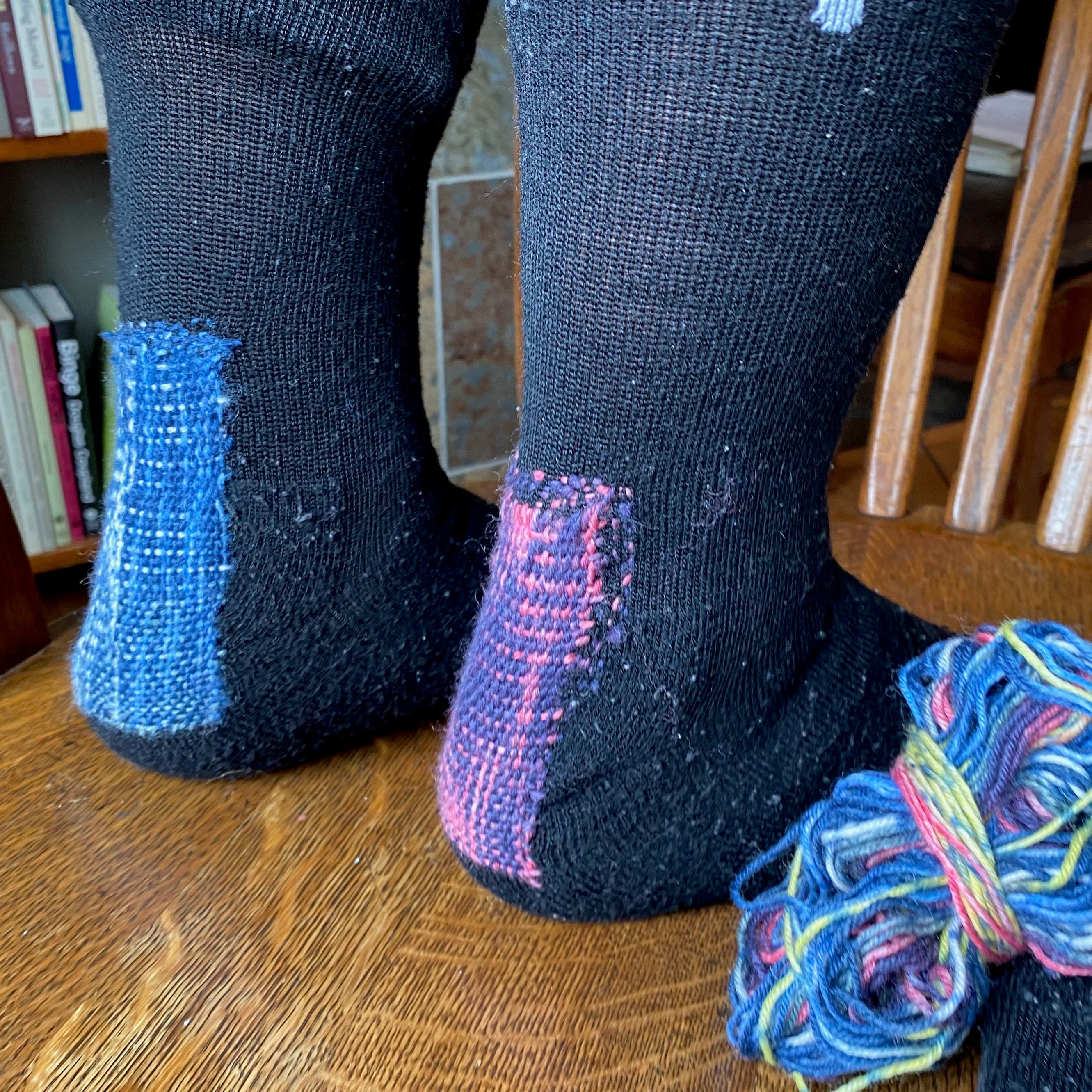 socks mended with mending/weaving loom (speedweve style)